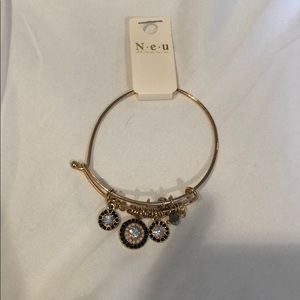 Gold bracelet with dangling gems